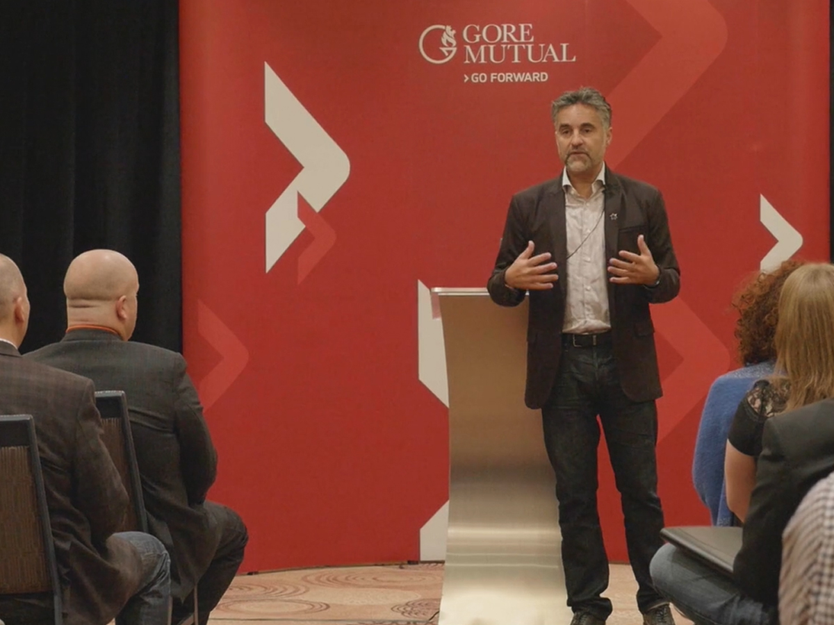 Picture of Bruce Croxon presenting at GoreMutual meeting