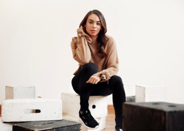 picture of model, Sarah sitting on stoll